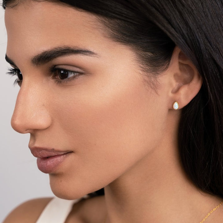 Golden drop gemstone earrings