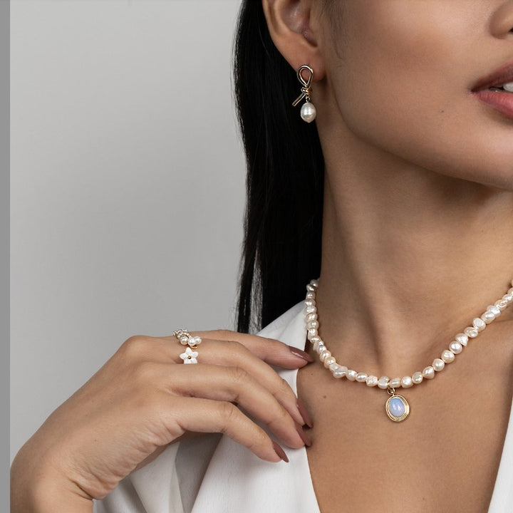 Knotted gold and freshwater pearl earrings